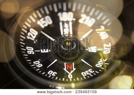 Close Up Of A Naval Compass With Bokeh