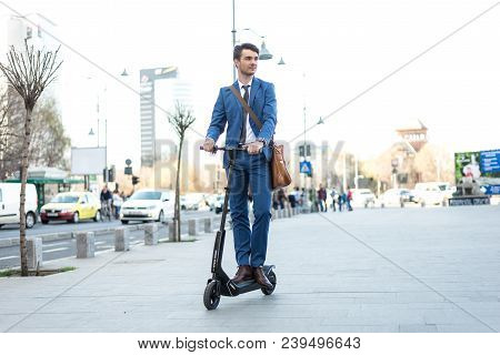 Bucharest, Romania, - Octomber 26, 2017: Using Electric Scooter On The Street On A Sunny Day With Sa