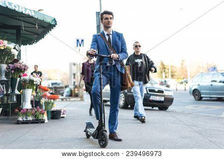 Bucharest, Romania, - Octomber 26, 2017: Using Electric Scooter On The Street On A Sunny Day With Sa