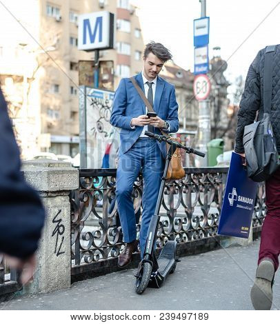Bucharest, Romania, - Octomber 26, 2017: Using Electric Scooter On The Street On A Sunny Day With Sa