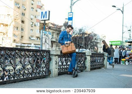 Bucharest, Romania, - Octomber 26, 2017: Using Electric Scooter On The Street On A Sunny Day With Sa