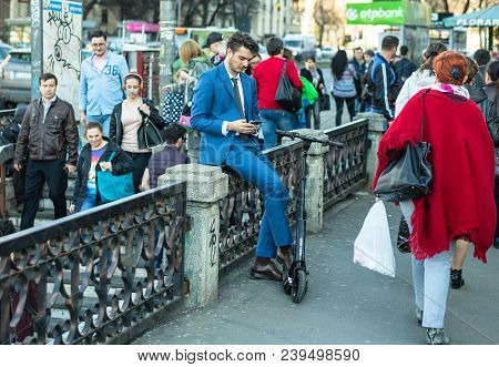 Bucharest, Romania, - Octomber 26, 2017: Using Electric Scooter On The Street On A Sunny Day With Sa