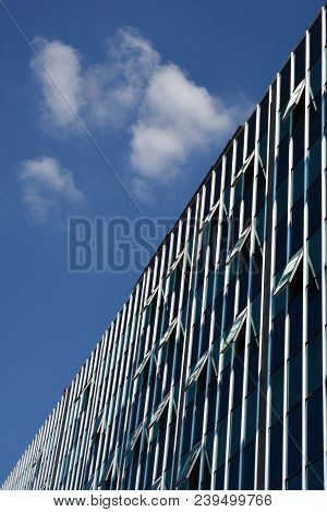 Looking Up - Diagonal Composition Of Sky And Building With Open Windows