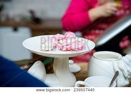 Close Up Bright Pink And White French Cookies Macarons On White Stand