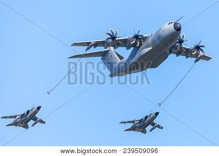 Berlin / Germany - April 28, 2018: Military Airbus A 400 M Transport Plane Flies With Two Panavia To