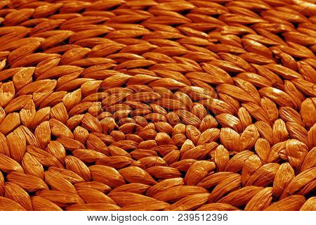 Round Straw Mat Texture In Orange Tone. Abstract Background And Texture For Design.