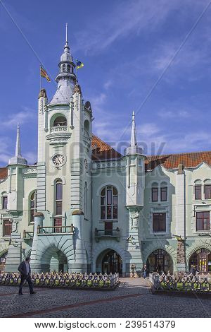 Ratusha In Ukrainian City. Mukachevo Old City Center At Day. Warm Sunny Spring Day And Blue Sky.