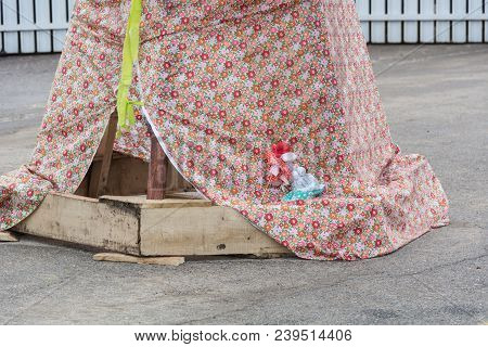 The Motanka Doll At The Base Of The Scarecrow