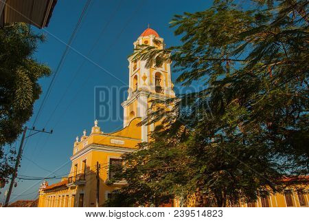 Trinidad, Cuba. The Bell Tower Of San Francisco De Asis Against The Blue Sky.