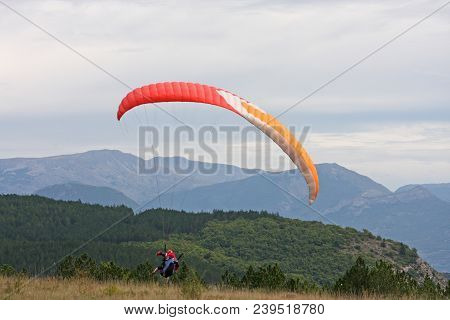 Paraglider Landing Wing In The French Alps