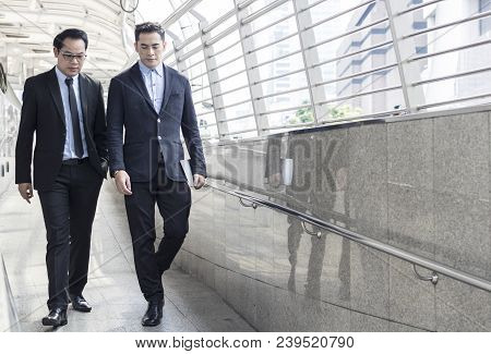 Two Business Talking With Partner About Business And Invetment  On Way To Office