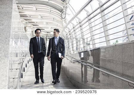 Two Business Talking With Partner About Business And Invetment  On Way To Office