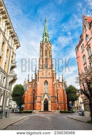 Riga, Latvia - August 22, 2017: View On Saint Gertrude Old Church And Bright Blue Sky, Riga Latvia. 
