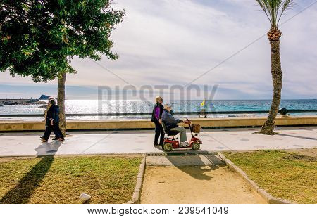 Benidorm, Spain - January 14, 2018: People Walking Enjoying Holiday Near The Sea, Benidorm, Spain