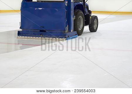 Resurfacing Machine Cleaning Ice Of Hockey Rink.