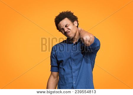 Pain Concept. Beautiful Male Portrait Isolated On Orange Backgroud. Young Emotional Afro Man. Human 