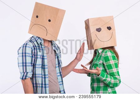 Disappointed Man With Bags Over Heads Rejecting His Woman