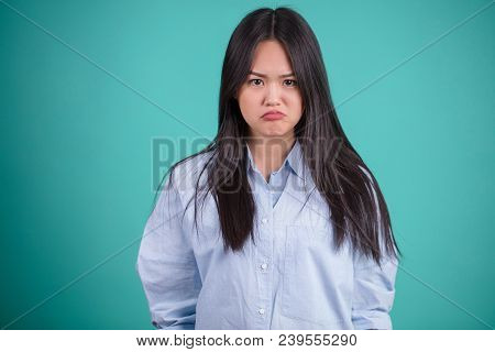Disappointed Young Asian Woman With Pursed Lips Looking At Camera As If She Is Upset Not Getting Wha