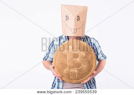 Golden Bitcoin In A Man Hand, Digitall Symbol Of A New Virtual Currency