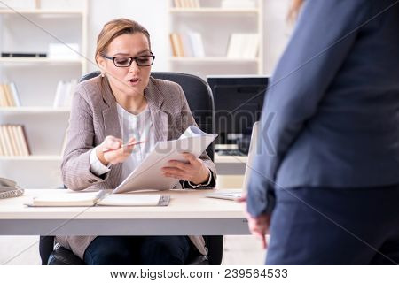 Angry boss dismissing employee for bad underperformance