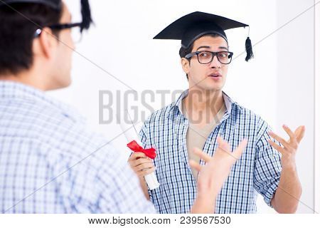 Young student planning graduation speech in front of mirror