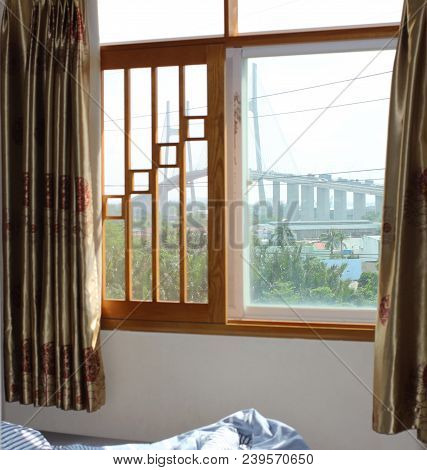 Closed Window Overlooking The Cable-stayed Bridge In Saigon (vietnam)