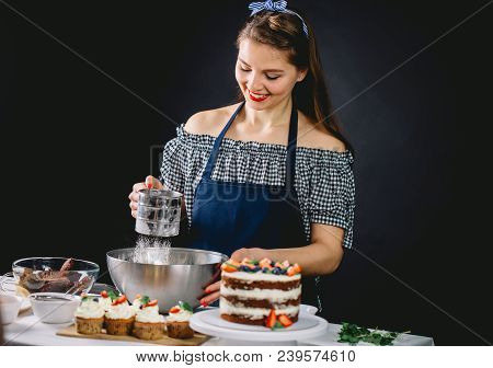 Woman Bakery Chef Sifts Flour, Preparing The Dough For Cupcakes.