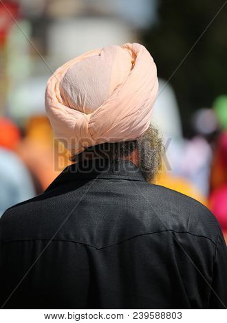 Senior Sikh Man With Long Beard And Turban On His Head