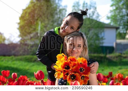 Happy Family In The Red And Yellow Tulips Field