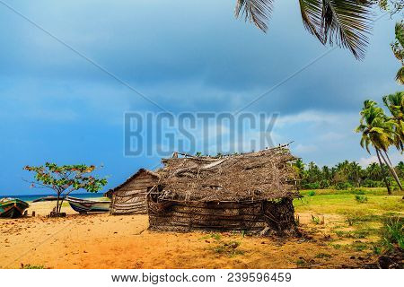Thatched Coconut Leaf House Or Fishing Hut On Tropical Beach. Traditional Or Vintage Eco Friendly Ho