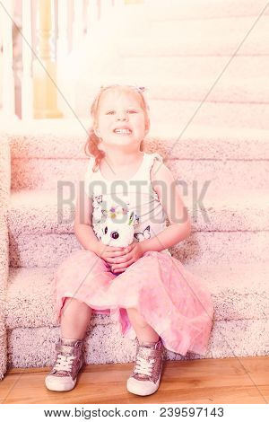 Tle Girl With Her Toy In Cute Pink Tutu.