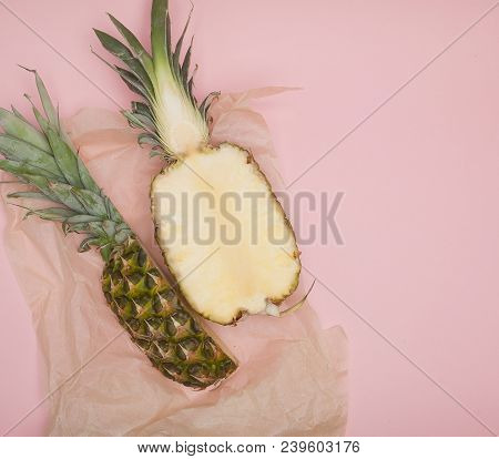 Half Cut Juicy Pineapple On A Pastel Pink Background. Minimal Summer Concept.