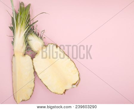 Half Cut Juicy Pineapple On A Pastel Pink Background. Minimal Summer Concept.