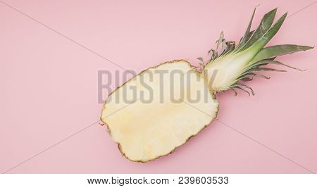 Half Cut Juicy Pineapple On A Pastel Pink Background. Minimal Summer Concept.