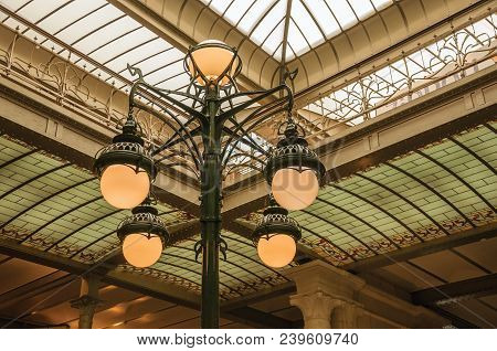 Brussels, Central Belgium - July 04, 2017. Art Nouveau Lamp And Glass Ceiling In An Old Building, At