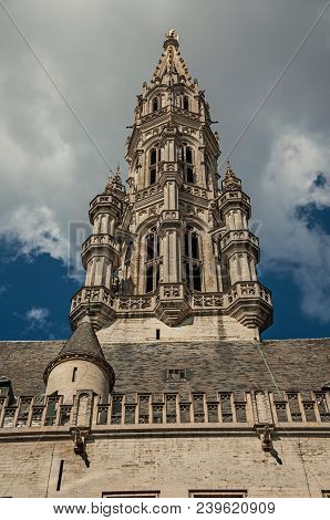 City Hall Building And Its Gothic Tower At The Grand Place Of Brussels. Vibrant And Friendly, Is The