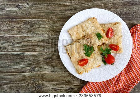 Pie, Casserole Pita With Mushrooms, Cottage Cheese And Cheese On A White Plate On A Wooden Backgroun