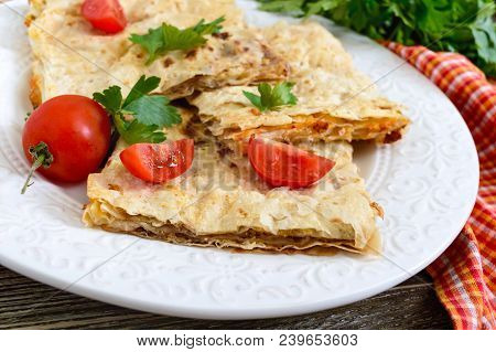 Pie, Casserole Pita With Mushrooms, Cottage Cheese And Cheese On A White Plate On A Wooden Backgroun