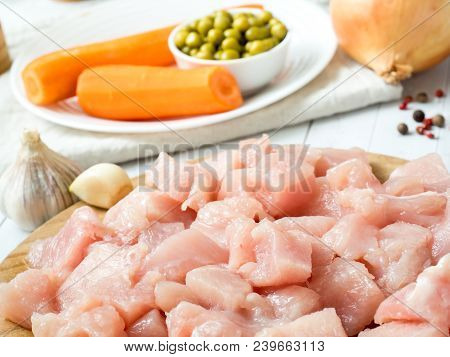 Sliced Chicken Meat For Cooking Vegetables On Table