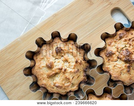 Home-baked Cakes On The Kitchen Table In The Baking Dish