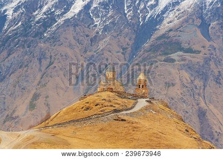 Holy Trinity Church Near The Village Of Gergeti In Georgia