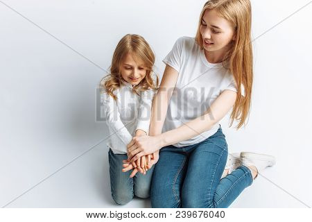 Mom And Little Daughter Looking At Each Other, Happy Family, Isolated Background, Cute And Beautiful