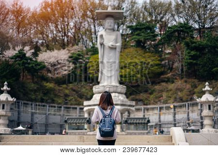 Young Asian Traveler Traveling Into Bongeunsa Temple In The Gangnam District Of Seoul, South Korea.