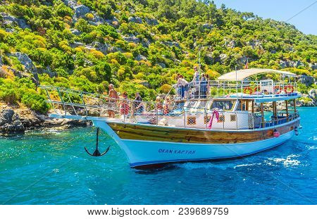 Kekova, Turkey - May 10, 2017: The Pleasure Boat With Tourists At The Coast Of Kekova Island, People