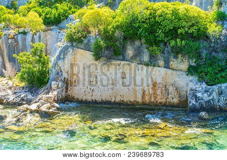 Preserved Stone Wall On The Coast Of Kekova Island, Popular Tourist Place With Preserved Ruins Of Su