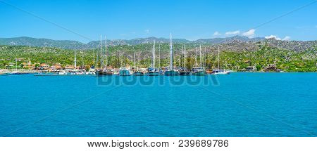 The Scenic Seascape Of Kekova Bay With  View On Yacht Port Of Ucagiz Village And Taurus Mountains On