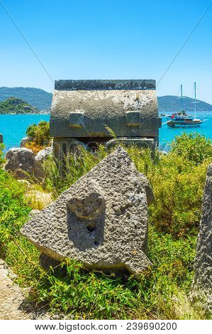 The Broken Stone Tombs In Lycian Necropolis, Located In Ucagiz Village, On The Shore Of Kekova Bay, 