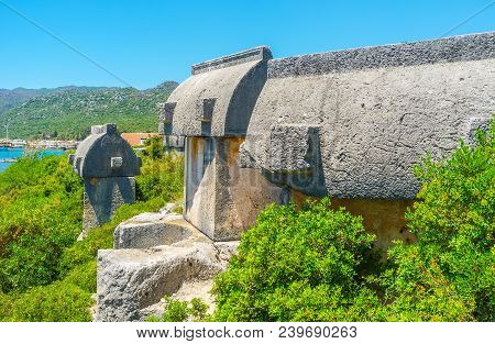 The Arhaeological Site Of Lycian Tombs Next To The Ucagiz Village - Carved Stone Sarcophagi Located 