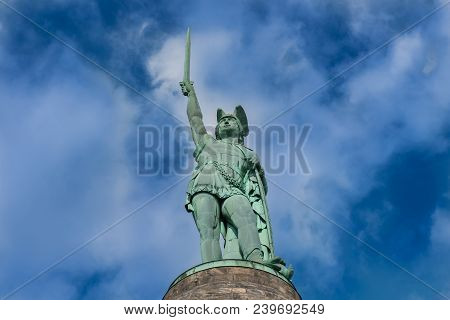 Hermann's Monument On Stone Pedestal In Front Of Sunny, Blue Sky