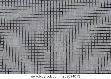 Background Of A Small Old White Tile On The Building